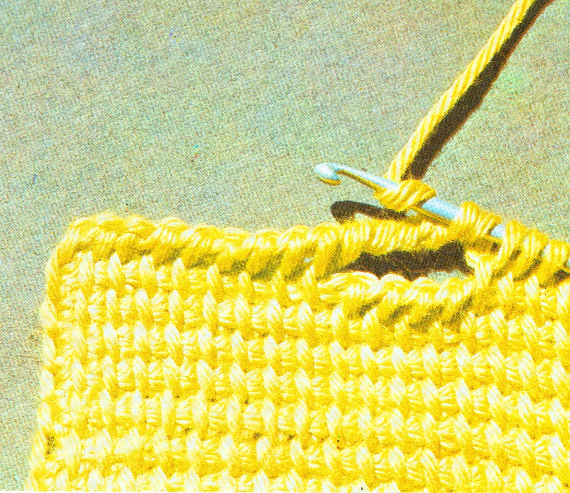 Winding the yarn around the hook for a buttonhole